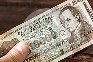 Paraguayan banknote 10000 guaranies in hand photo