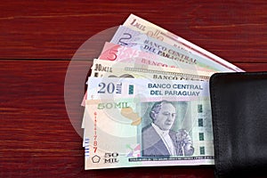 Paraguayan Guaranies in the black wallet photo