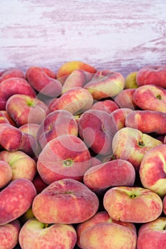 Paraguayan sweet peaches stacked in a container box to the raw for sale, cpy space