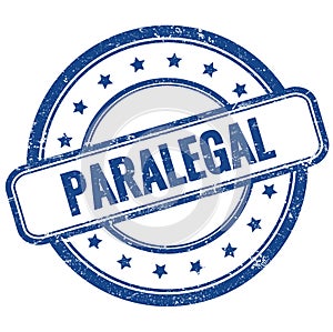 PARALEGAL text on blue grungy round rubber stamp