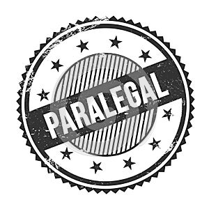 PARALEGAL text written on black grungy round stamp