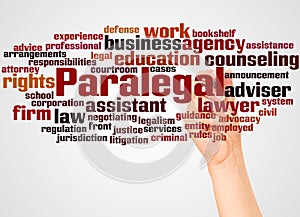 Paralegal word cloud and hand with marker concept