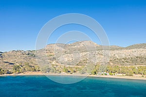 Paralia karathona Beach on arid rocky coast and countryside, Europe, Greece, Peloponnese, Argolis, Nafplion, Myrto seashore, in