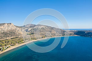 Paralia karathona Beach on arid rocky coast and countryside, Europe, Greece, Peloponnese, Argolis, Nafplion, Myrto seashore, in