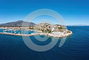 Paralio Astros port, Arcadia, Peloponnese, Greece. Aerial drone view of town, breakwater, boat, sea photo