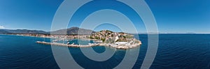 Paralio Astros port, Peloponnese Greece. Aerial drone panoramic view of town, boat, sea, sky. Banner photo