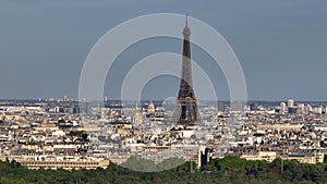 Parallax effect. Close-up shot of the Eiffel tower on a drone from a height. Aerial Panorama of Paris Cityscape