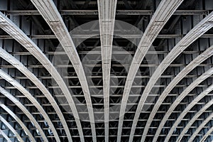 Parallel steel beams supporting bridge span