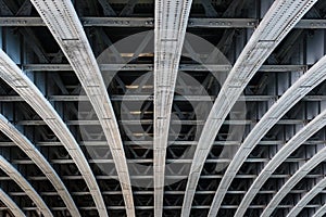 Parallel steel beams supporting bridge span