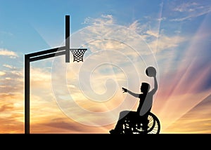 Paralympic disabled person in wheelchair playing basketball