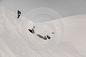 Paralympic snowboarder jumping down the white snow covered hill