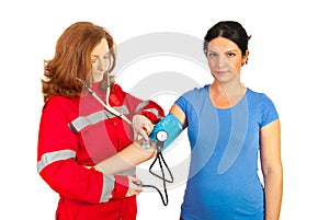 Paramedic checking blood pressure photo