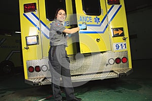 Paramedic, closing the door of the ambulance