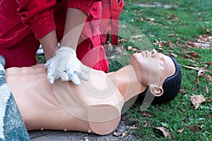 Paramedic demonstrate Cardiopulmonary resuscitation - CPR on dummy. First aid training.