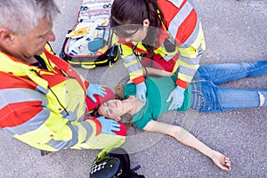 Paramedic and emergency doctor at site of traffic accident