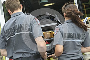 Paramedic employee with ambulance in the