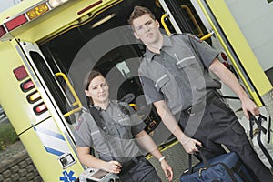 Paramedic employee with ambulance in the