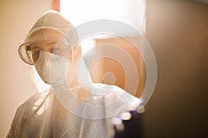 Paramedic in equipment against the backdrop of sunlight. Break. Pandemic. Fighting Coronavirus.