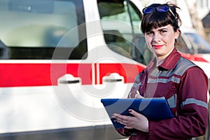 Paramedic female at emergency car