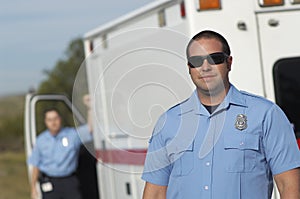 Paramedic In Front Of Ambulance