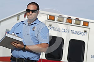 Paramedic In Front Of Ambulance