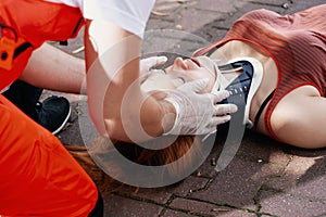 Paramedic helping a car accident victim