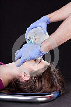 Paramedic helping a woman