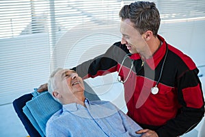 Paramedic interacting with patient