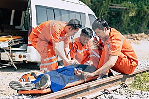 paramedic mobile car medical emergency team working in action help first aid save people life at accident site outdoors