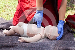 Paramedic performing infant CPR