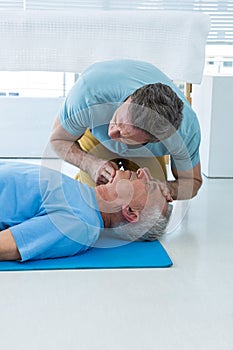 Paramedic performing resuscitation on patient