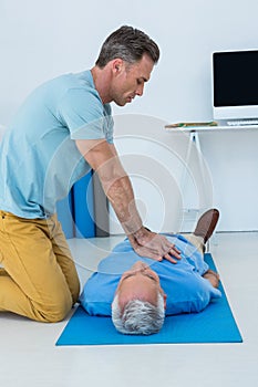 Paramedic performing resuscitation on patient