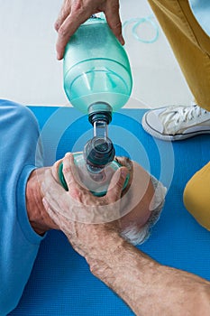 Paramedic performing resuscitation on patient