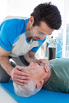 Paramedic performing resuscitation on patient