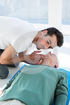 Paramedic performing resuscitation on patient