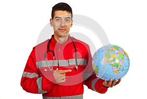 Paramedic pointing to earth globe