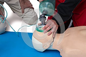 Paramedic practicing cardiopulmonary resuscitation on dummy