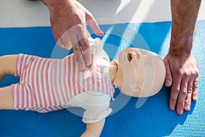 Paramedic practising resuscitation on dummy