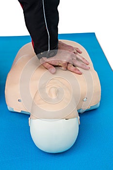 Paramedic practising resuscitation on dummy