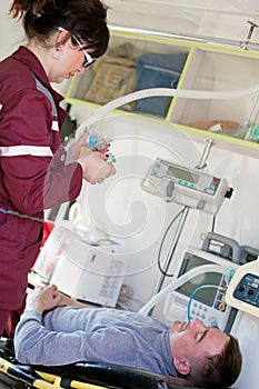 Paramedic preparing oxygen mask