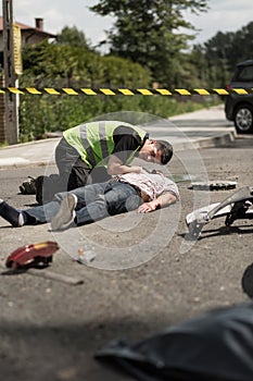 Paramedic resuscitating traffic collision victim