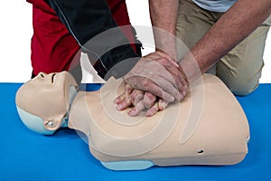 Paramedic training cardiopulmonary resuscitation to man