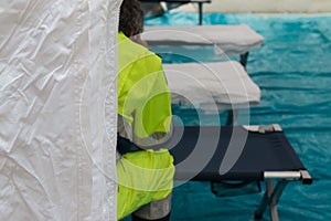 Paramedic Waiting for Emergency inside Temporary Rescue Control