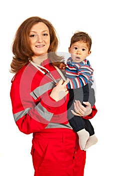 Paramedic woman holding baby