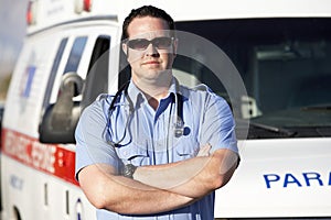 Paramedic Worker In Front Of Ambulance