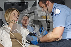 Paramedics Taking Care Of Victim In Ambulance