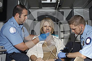 Paramedics Taking Care Of Victim In Ambulance