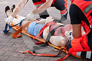 Paramedics taking woman to the hospital photo