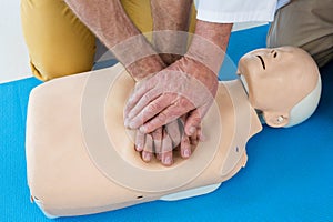 Paramedics training cardiopulmonary resuscitation to man