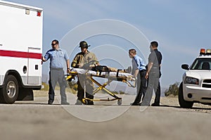 Paramedics Transporting Victim On Stretcher